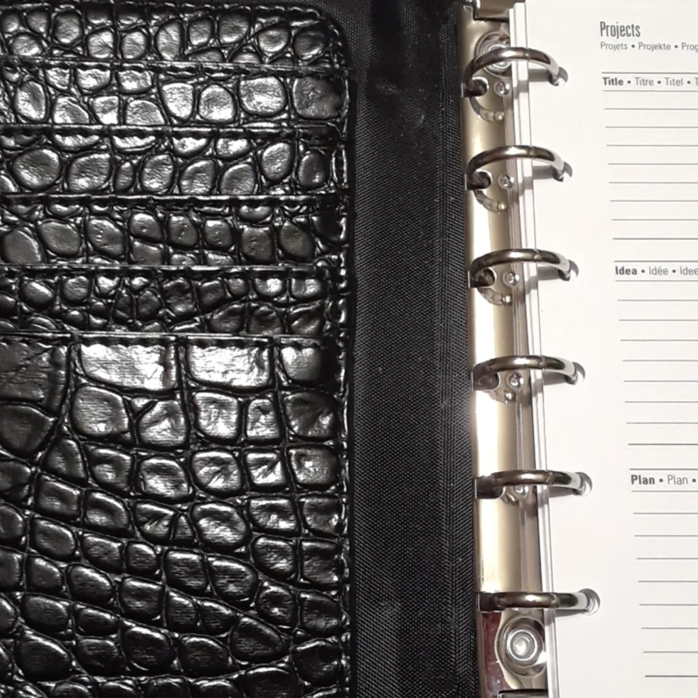 Black 6 ring planner 6.5 x 10.5 Faux leather snake style pattern. New.